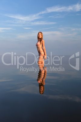 girl posing in the Water at sunset,