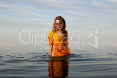 girl posing in the Water at sunset