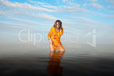 girl posing in the Water at sunset