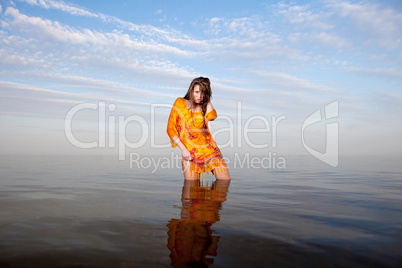 girl posing in the Water at sunset