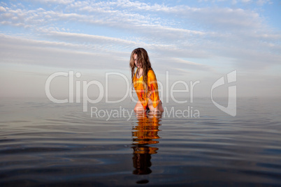 girl posing in the Water at sunset