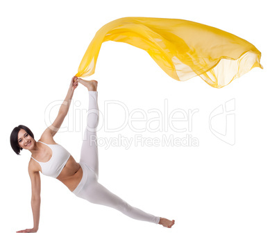 woman exercise yoga pose with yellow flying veil