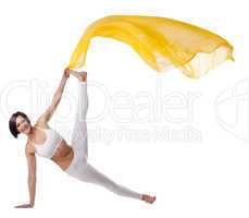 woman exercise yoga pose with yellow flying veil
