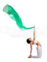 woman doing yoga pose with green fabric fly air