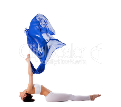 woman exercise yoga pose with blue flying veil