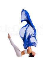 woman doing yoga with blue cloth in air isolated