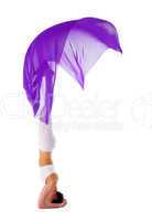 woman with flying purple cloth doing yoga isolated