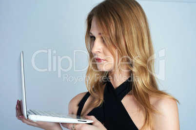 Attractive blonde girl with laptop