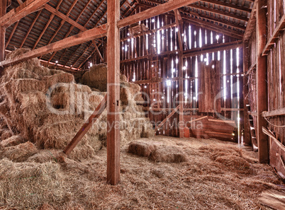 Interior of old barn with straw bales