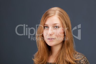 Portrait of red-haired young woman