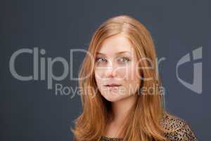 Portrait of red-haired young woman