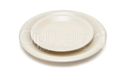 Plain beige dinner plate and  saucer isolated