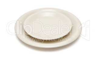 Plain beige dinner plate and  saucer isolated