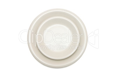 Plain beige dinner plate and  saucer isolated top view