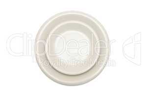Plain beige dinner plate and  saucer isolated top view