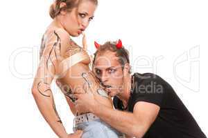 devil boy and  body-painted blonde woman