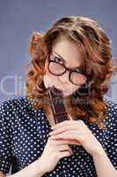 happy smiling woman eating chocolate