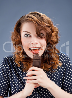 happy smiling woman eating chocolate