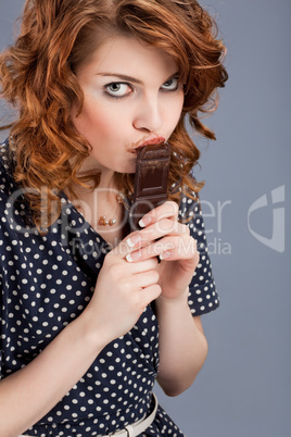 happy smiling woman eating chocolate