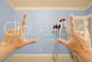 Hands Framing Blue Painted Wall Interior