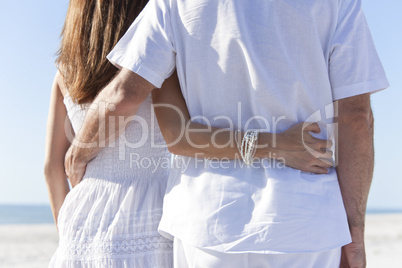 Rear View of Couple on An Empty Tropical Beach