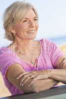 Happy Attractive Senior Woman Sitting Outside