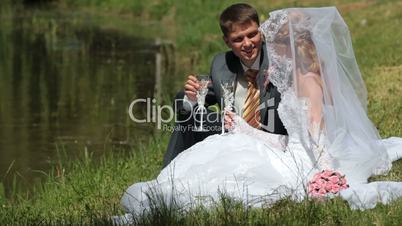 bride and groom by the lake