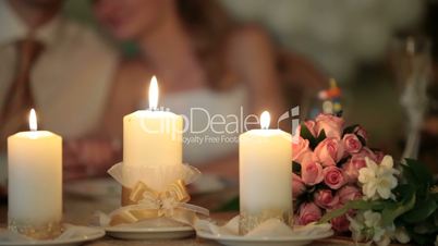 burning candles at the wedding table