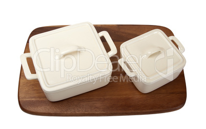 Two ceramic pots for stove on wooden kitchen board