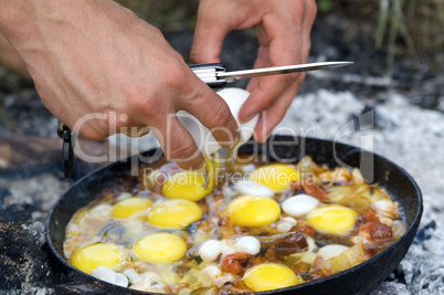 Fried eggs. Cooking on the fire