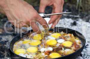 Fried eggs. Cooking on the fire