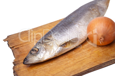 Herring with onion on old kitchen board
