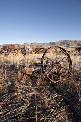 Old farm equipment in a field