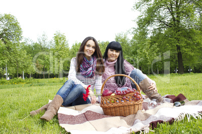 Mother and daughter relaxing outdoors