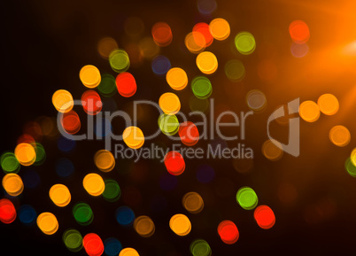 Blurred festive colorful lights over black
