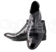 Pair of Black leather mens boots on white