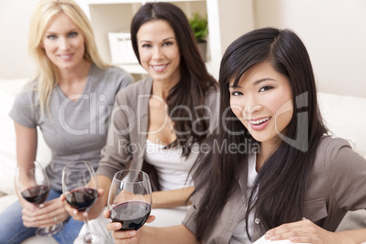 Group of Interracial Women Drinking Red Wine At Home