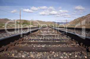 Steel railroad tracks for a train. landscape transportation trac