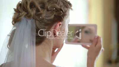 face of bride in  mirror