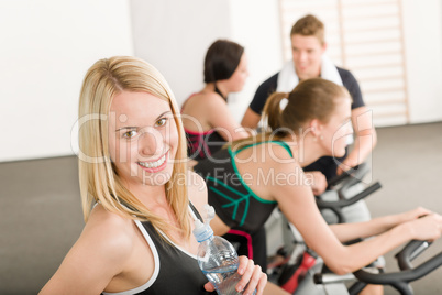 Fitness group of people on gym bike