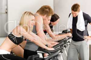 Fitness group of people on gym bike