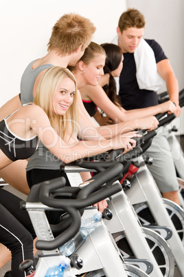 Fitness group of people on gym bike