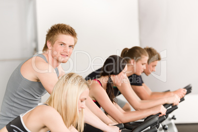 Fitness group of people on gym bike