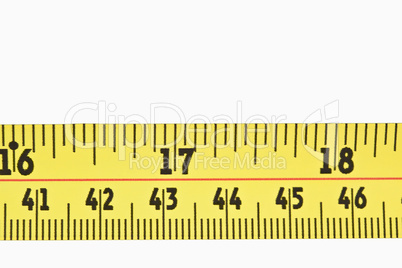 Close up of a part of a yellow measuring tape