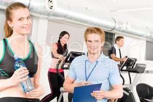 Young fitness instructor gym people exercise
