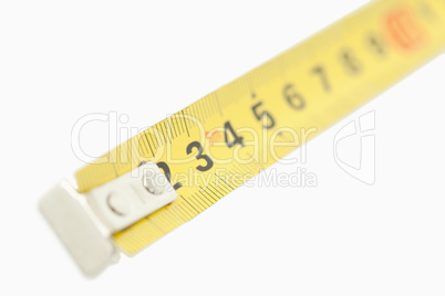 Camera focus on a yellow measuring tape