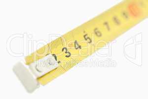 Camera focus on a yellow measuring tape
