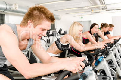 Fitness group of people on gym bike