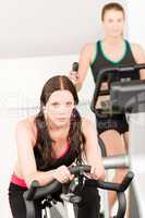 Fitness young girl on gym bike
