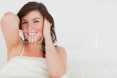 Charming brunette woman awaking while sitting